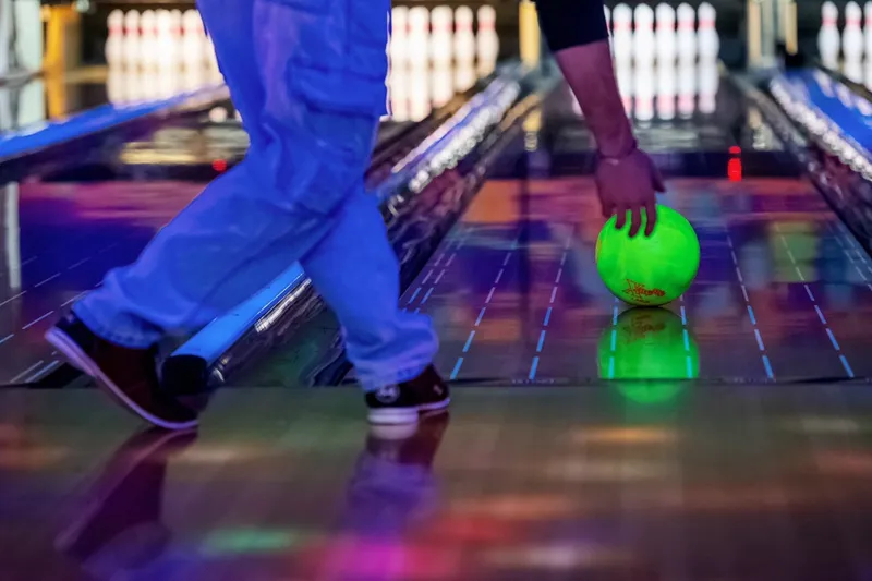man throwing bowling ball